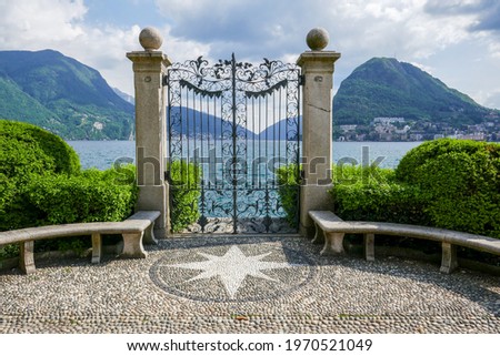 Elegant fence with round stone benches and a star shape in the mosaic stone floor (Ciani Park, Lugano, Switzerland). Zdjęcia stock © 