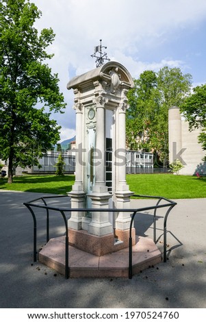 Old weather station in a classic white stone column including barometer, lumnimeter and weather vane. Location: the Ciani Park in Lugano (canton of Ticino, Switzerland). Zdjęcia stock © 