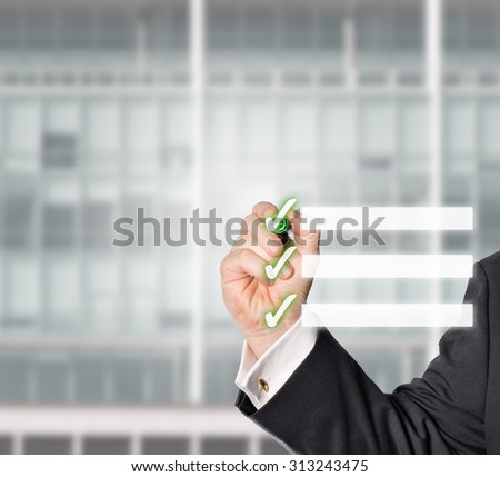 businessman hooked a Virtual check-list with a green check pen