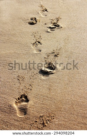 Footprints in sand - Costra Rei beach in Sardinia