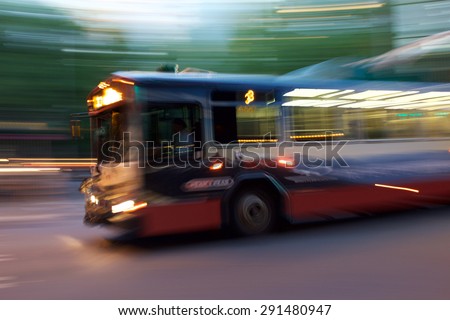 Seattle, USA - June 24, 2015 - Intentional blur of a city bus in the evening on the Seattle city streets