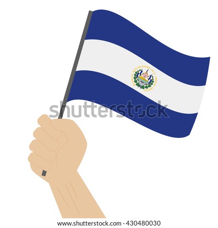 Hand holding and raising the national flag of El Salvador