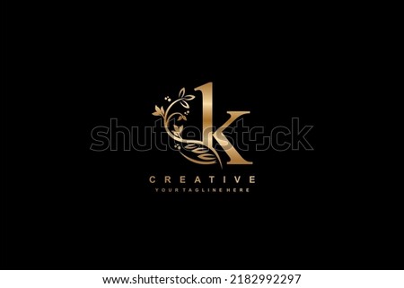 gold initial letter K logo design with beautiful and elegant flower and feather decoration. K design. icon K. design K Stok fotoğraf © 