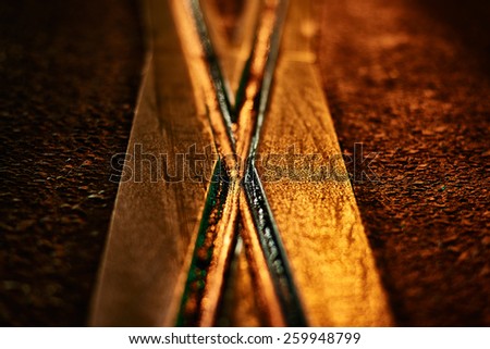 Tram rail texture at yellow lighting