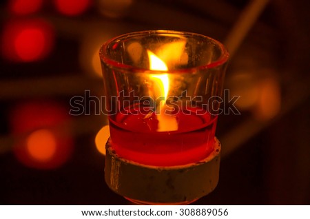 Candles light background. Candle flame at night. Holiday candles close up.m Abstract glowing background