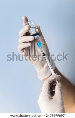 Similar – Image, Stock Photo Hand with syringe on red background with copy space