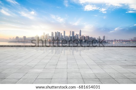 Photo of Panoramic skyline and buildings with empty concrete square floor
