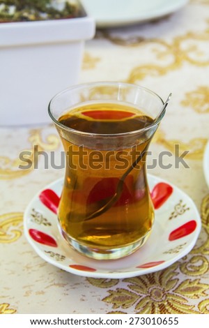apple Turkish tea in a traditional cup in a cafe in Istanbul