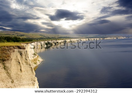 the cliff by the sea in cloudy weather