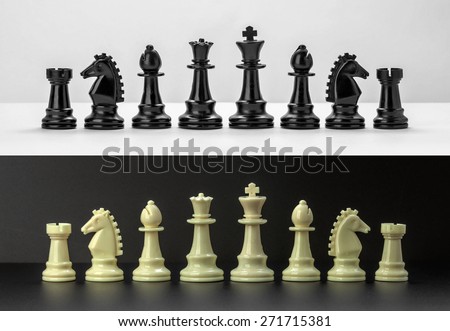 Chess pieces isolated on black and white background. Black and White Chess pieces are lined up. Set of chess figures.