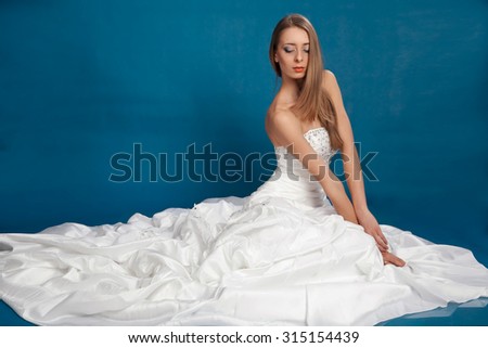 bride in white dress with her hair on a white background