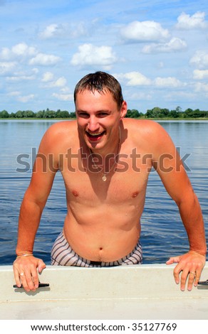 Happy young man on the boat