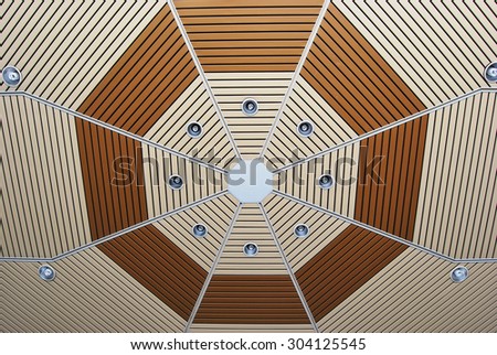 Ceiling with octagon pattern and compact fluorescent lamps.