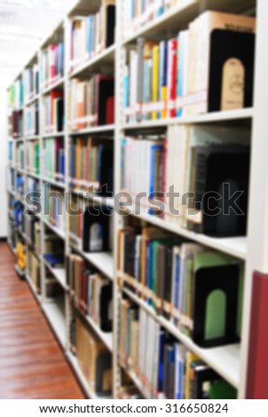 De focused/ Blurred image of books on bookshelf