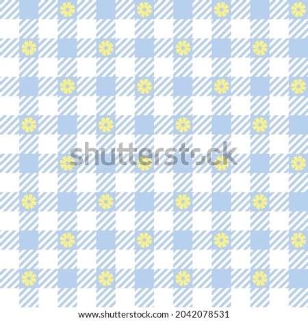Blue and white gingham with yellow flowers. Seamless vector embroidered plaid pattern. Seamless vector check pattern suitable for fashion, home decor and stationary.