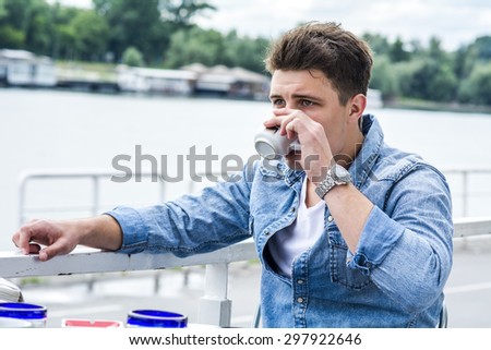 Young man outside by the river