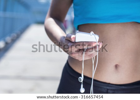 Fitness girl with mobile phone