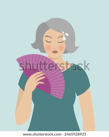 Woman cooling herself with fan, hot flashes, menopause symptoms.