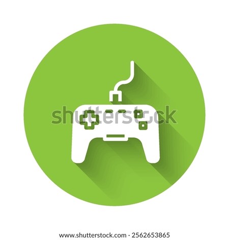 White Gamepad icon isolated with long shadow. Game controller. Green circle button. Vector