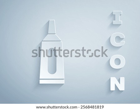 Paper cut Ointment cream tube medicine icon isolated on grey background. Tube, container, toothpaste, cream sign. Paper art style. Vector