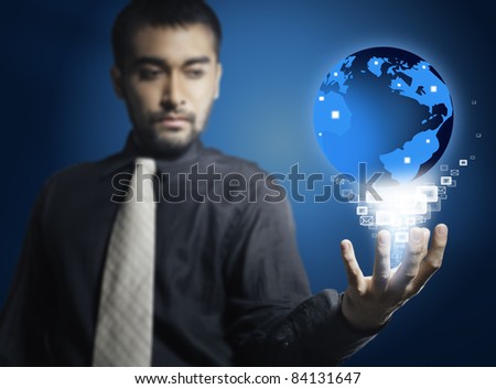 Man holding world in his hand with electronic mail icon