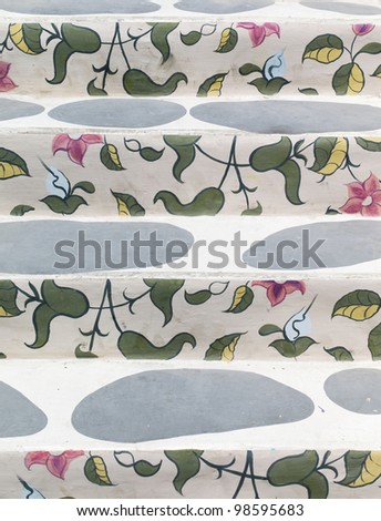 floral pattern painting on white cement stairs