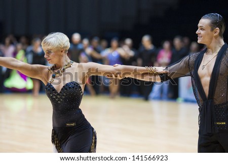 MINSK-BELARUS, MAY, 18: Unidentified Dance couple performs ADULT Latin-American program on World Open Minsk-2013  championship in May 18, 2013 in Minsk, Republic Of Belarus