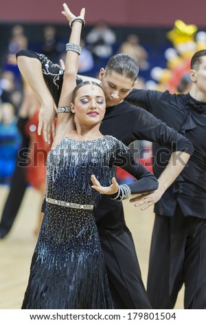 MINSK-BELARUS,FEBRUARY,9:Unidentified Dance Couple Performs Adult Latin-American Program on Ogni Stolicy(Lights of the Capital) 2014 WDSF  Championship on February, 9,2014,in Minsk,Republic of Belarus