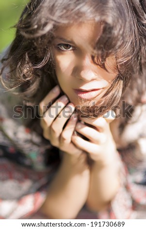 Beautiful Romantic Girl Outdoors. Sunlight Effect. Model With Long Hair Against Nature Background. Vertical Image