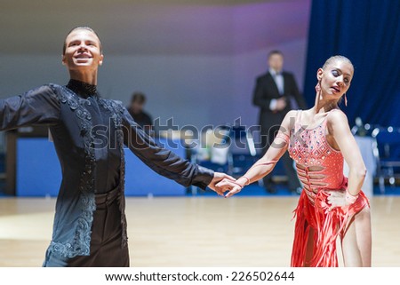 Minsk-Belarus, October 19, 2014: Kolesnev Sergey-Buldyk Arina perform Adult Latin-American Program on on IDSA World Open Championship 2014 in October 19, 2014, in Minsk, Republic of Belarus