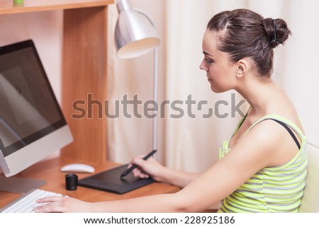 Young Female Designer Working on Professional Pen Tablet at Home. Horizontal Image Composition