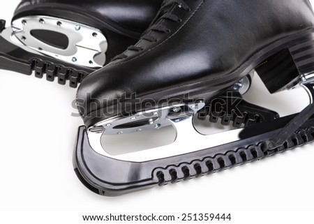 Figure Skating Concept: A Pair of Professional Male Figure Skates with Covers Over White Background. Horizontal Image Composition