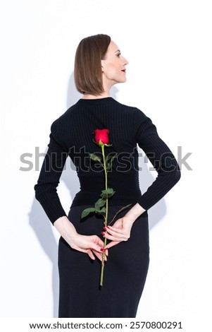 Similar – Image, Stock Photo Stylish black lady hiding behind curtain at home