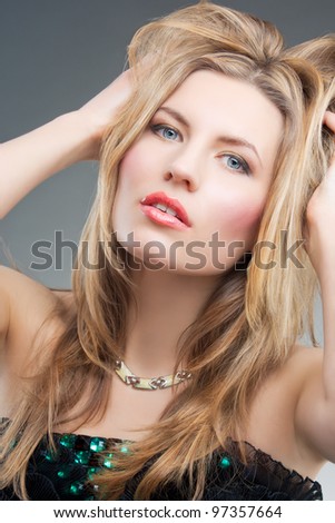 passionate blonde woman with hands lifted and staring