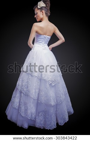 Caucasian female costume designer works on wedding gown - Stock Image -  Everypixel