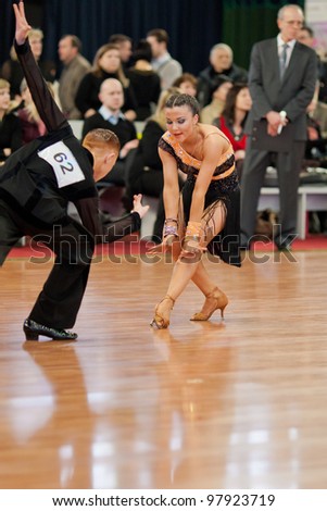 MINSK-BELARUS, MARCH 4: Unidentified Dance Couple performs Adults Latin-American Program on The Republic of Belarus WDSF Championship, 2 Stage, on March 4, 2012 in Minsk, The Republic of Belarus