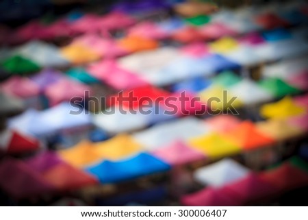 Blurred Background of Vignette Colorful Tents in the market.
