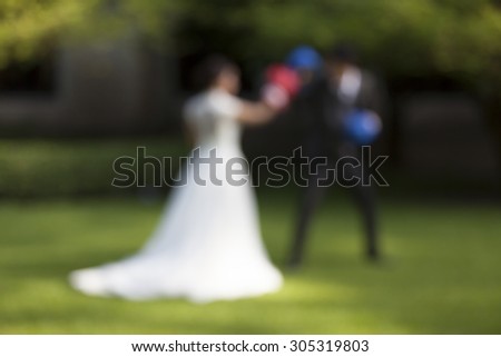 Bride and Groom wedding fun box, Funny married couple fighting. - (Blurred image)