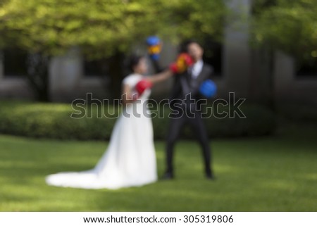 Bride and Groom wedding fun box, Funny married couple fighting. - (Blurred image)