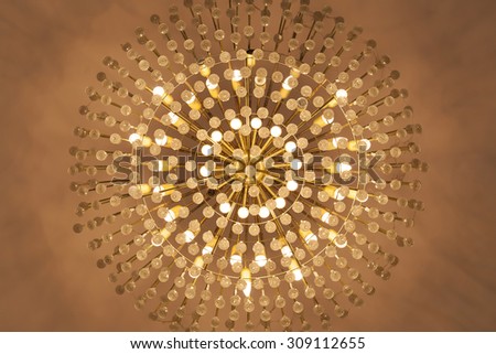 Lamp chandelier hanging from the ceiling in warm tone. - (Close up and Ant eye view)