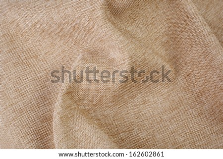Beige wrinkly textile material woven cloth