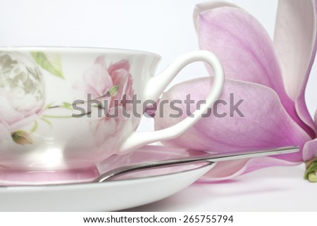 Cup of the and magnolia flower close up, Cup of tea with flower