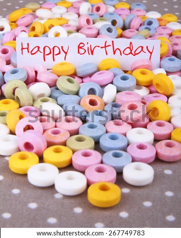 Small candies and inscription Happy Birthday