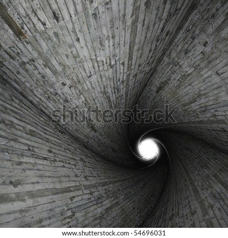 Interior of a spiral tunnel made of grungy concrete with bright light in the end