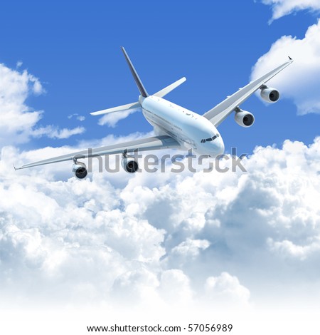 Big Jet airplane flying over a clear cloudscape seen from the top front, clipping path on the plane for easy isolation from the background