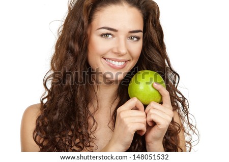 Professionaly retouched HD full-frame capture. Beautiful brunette holding apple