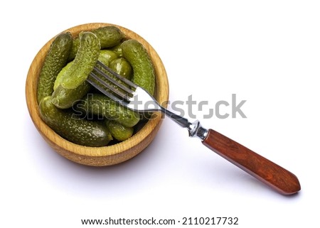 Bowl of Tasty canned Whole green cornichons isolated on a white background Photo stock © 