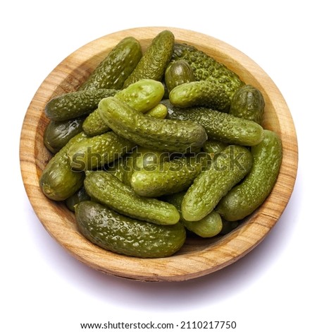 Bowl of Tasty canned Whole green cornichons isolated on a white background Photo stock © 