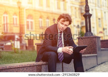 Handsome mature caucasian businessman outdoor wearing suit