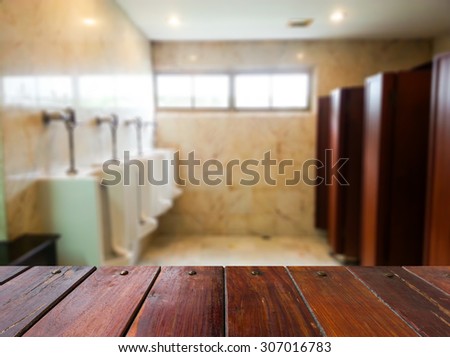 Look out from the table, blur image of the men toilet, used for product show and other related illustrations .